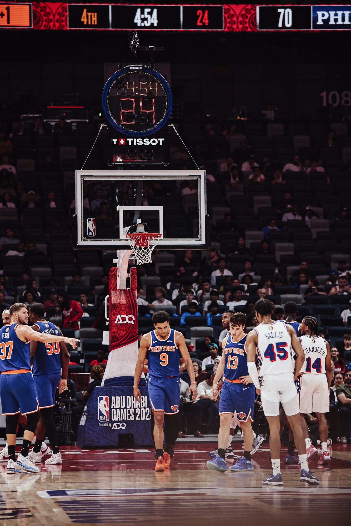 New York and Philadelphia players lining up under the basket with the shot clock above