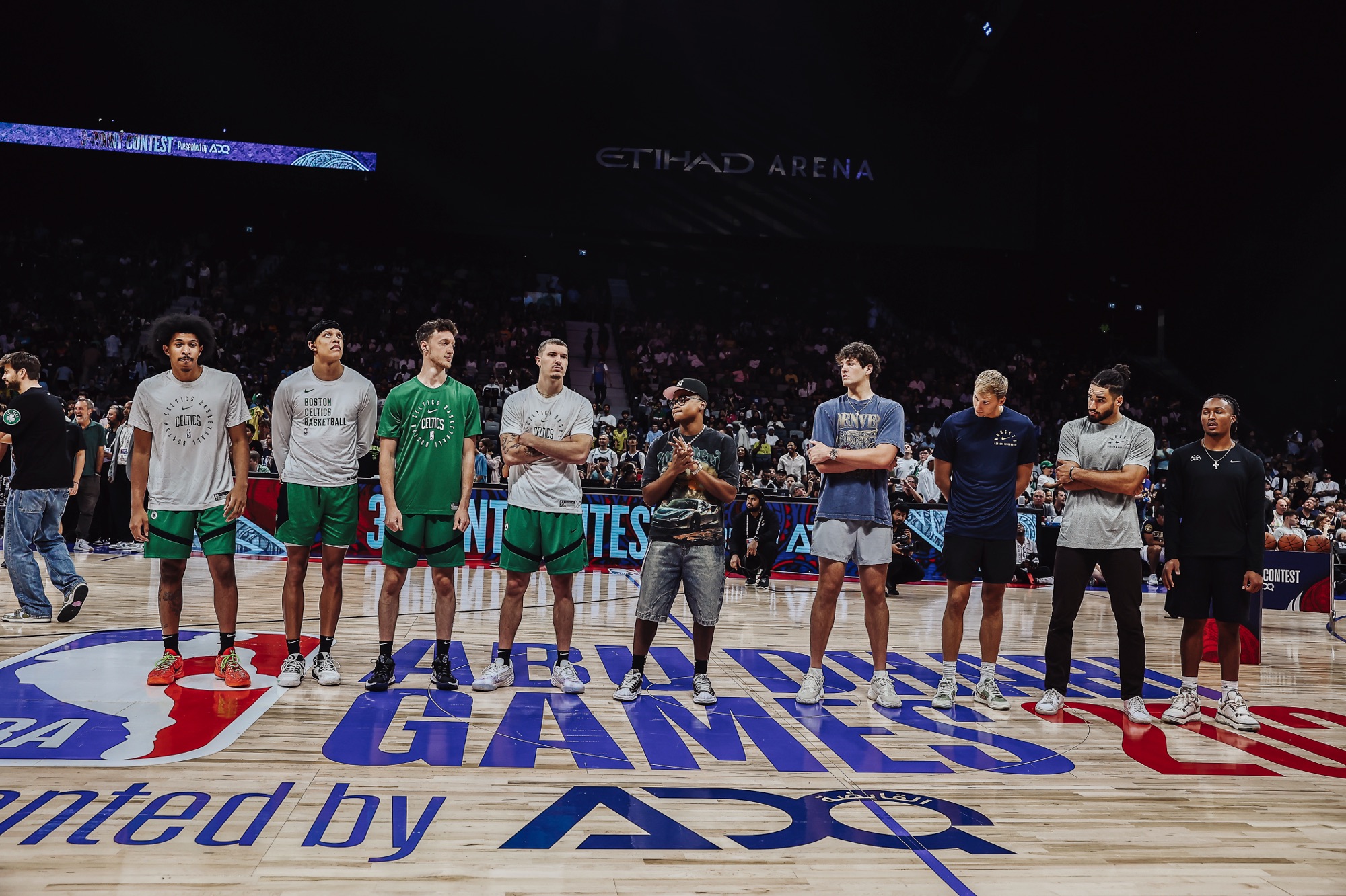 Players and guests lined up on court at Etihad Arena during the Abu Dhabi Games