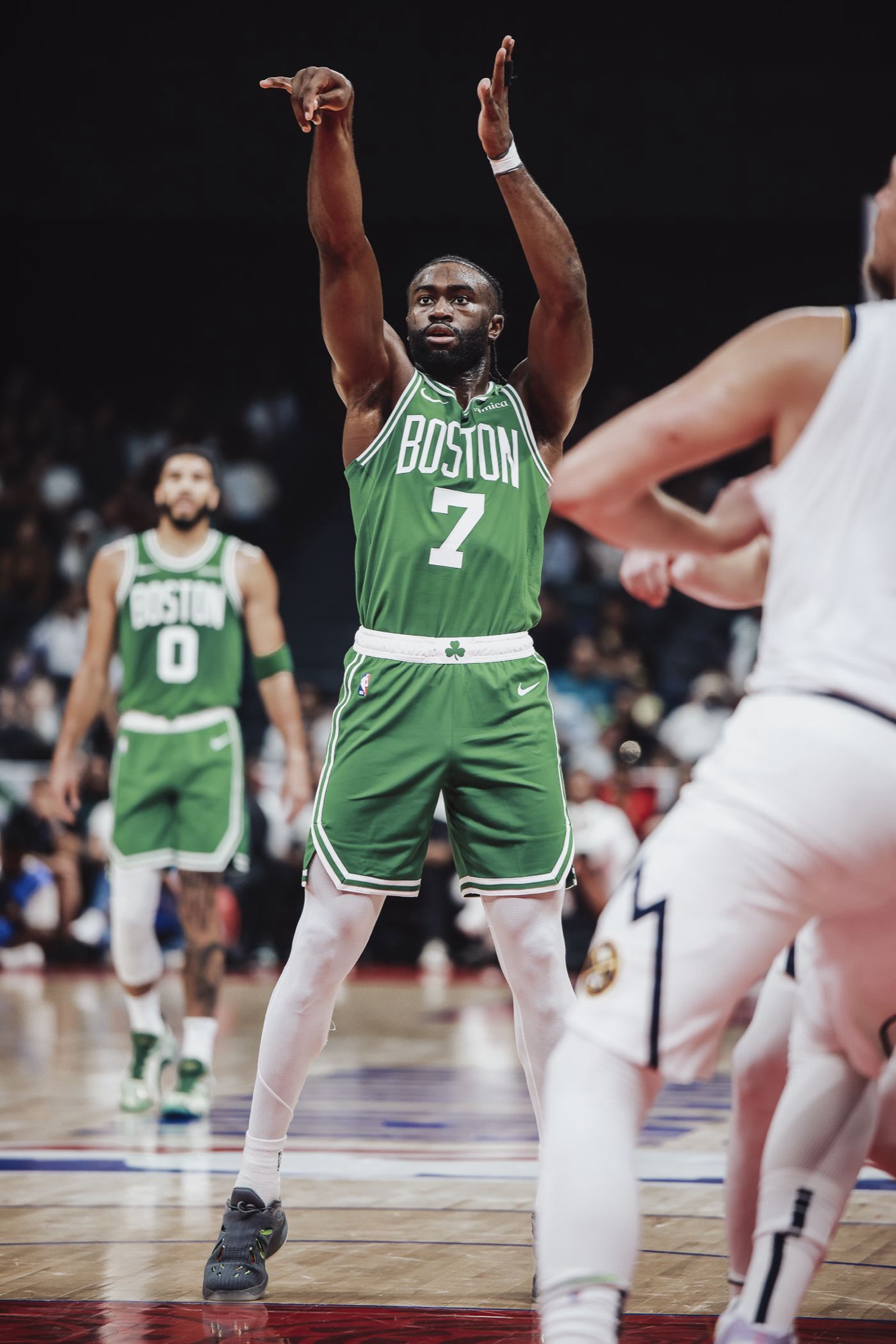 Player in a green jersey shooting a free throw